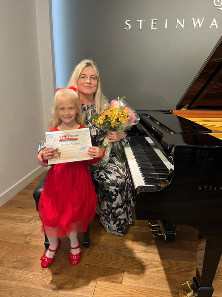 Tetiana Ordono with a piano student